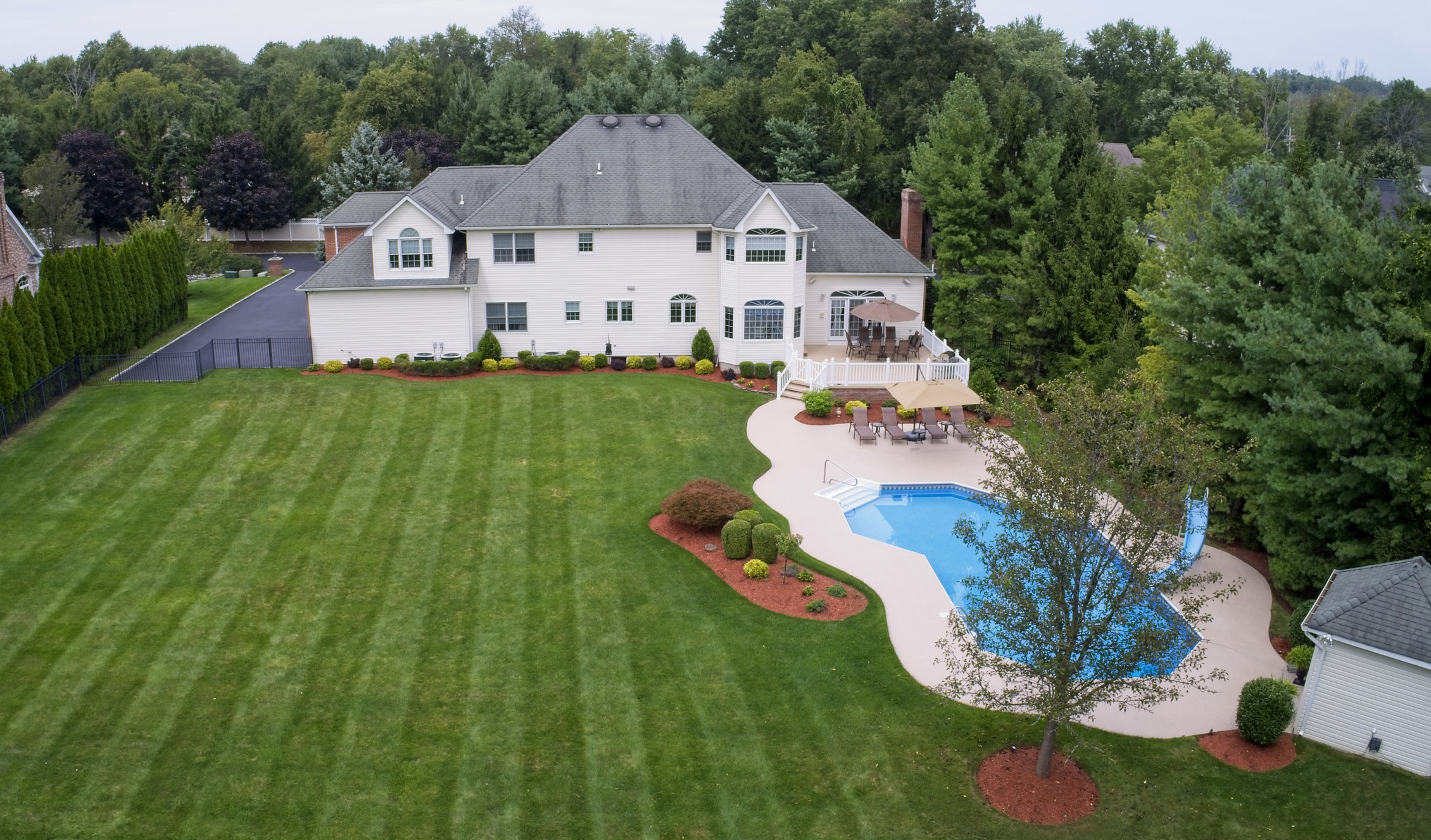 Looking down at back yard of luxury home.