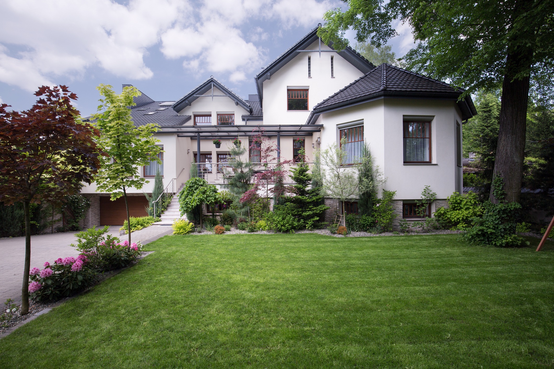 External view of white house with grass in front yard