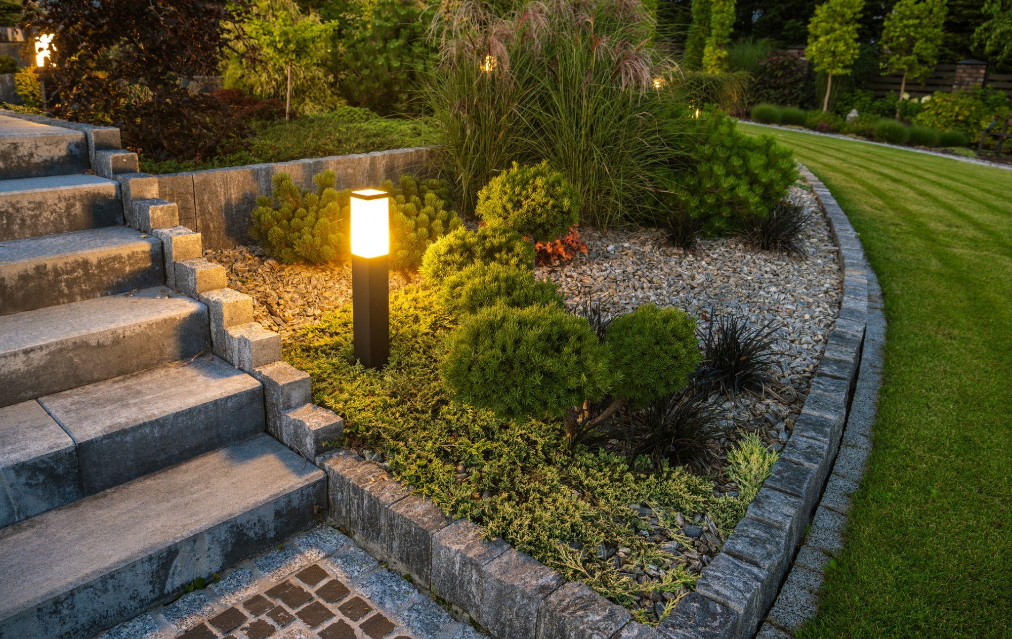 Landscape lighting near stairs and garden bed